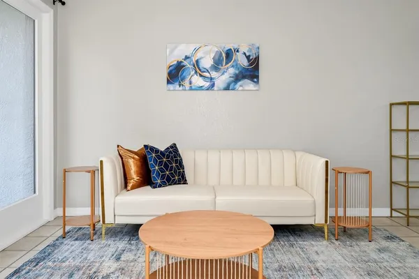 a bedroom with a bed and a couch