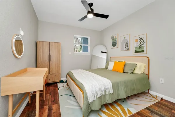 a bedroom with a bed and a table in it