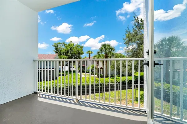 a view of a porch with a small yard