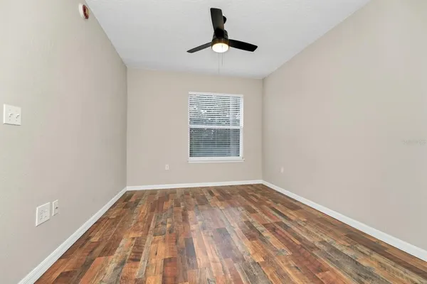 a view of room with window and hardwood floor