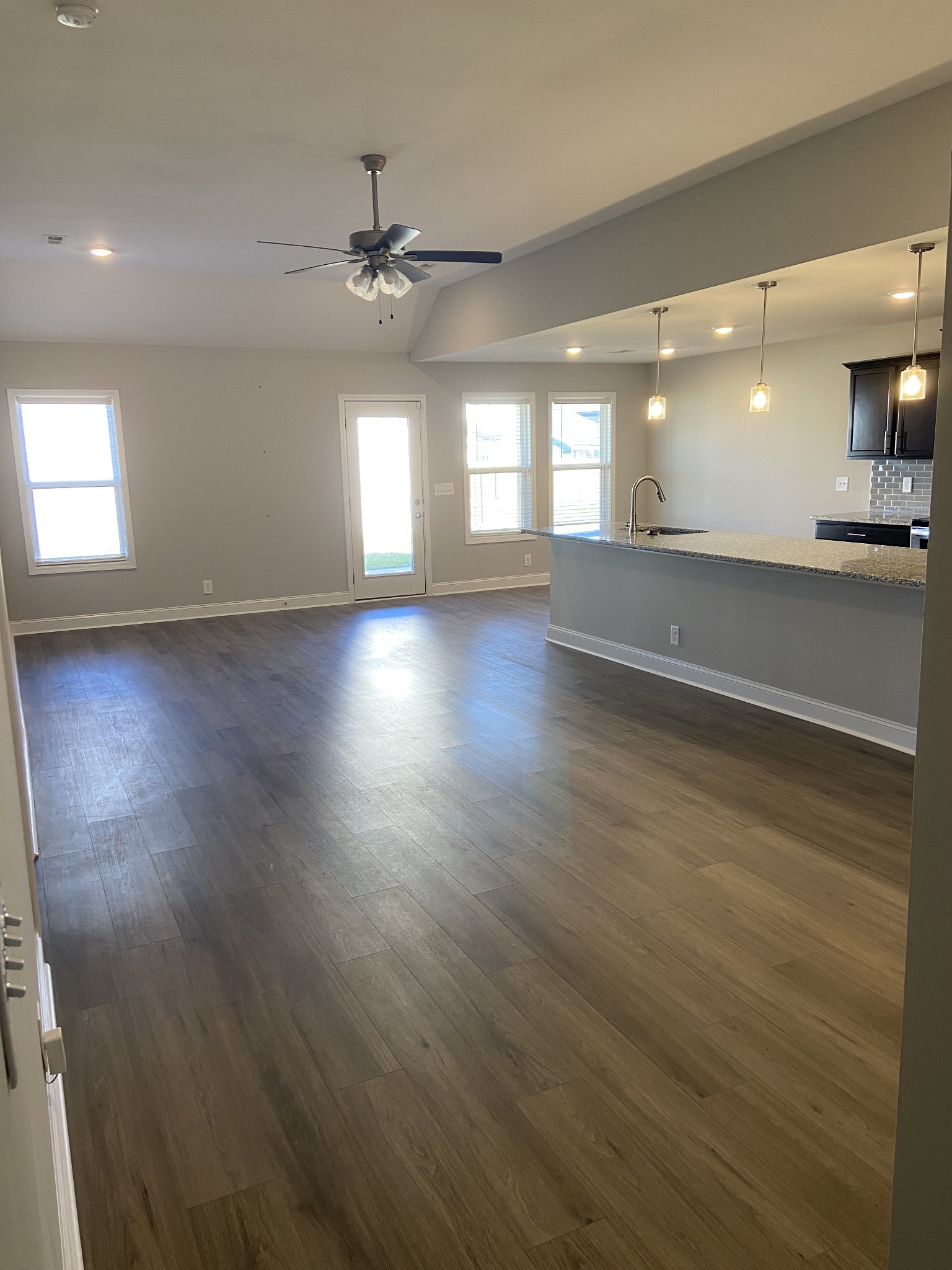 211 King Road Clarksville, TN 37042 - Photo 11 of 35 an empty room with wooden floor and windows