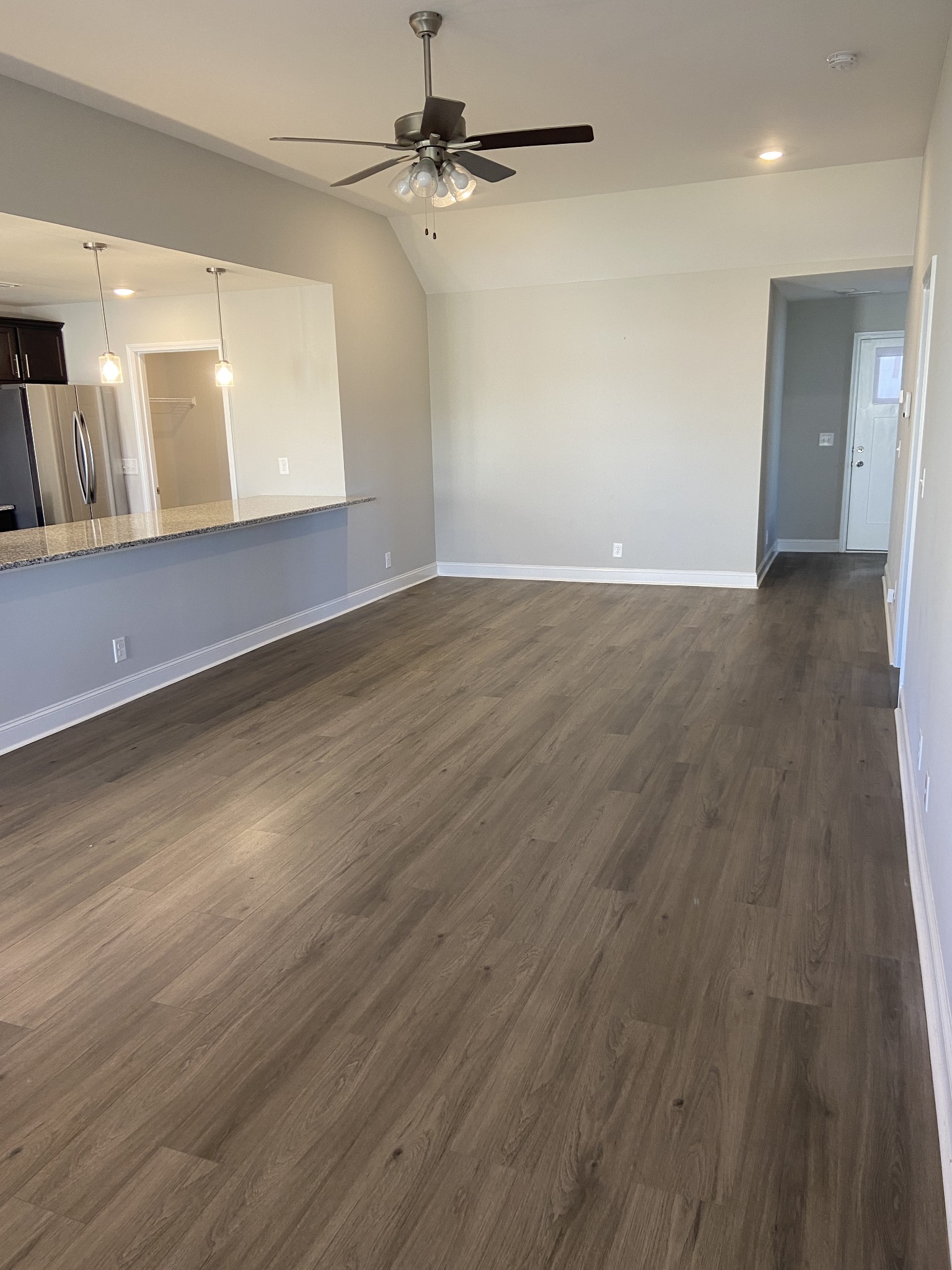 211 King Road Clarksville, TN 37042 - Photo 12 of 35 an empty room with wooden floor and windows