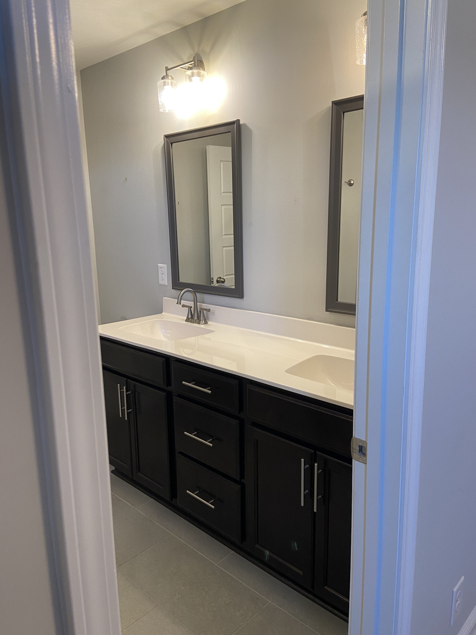 211 King Road Clarksville, TN 37042 - Photo 17 of 35 a bathroom with a double vanity sink and a mirror