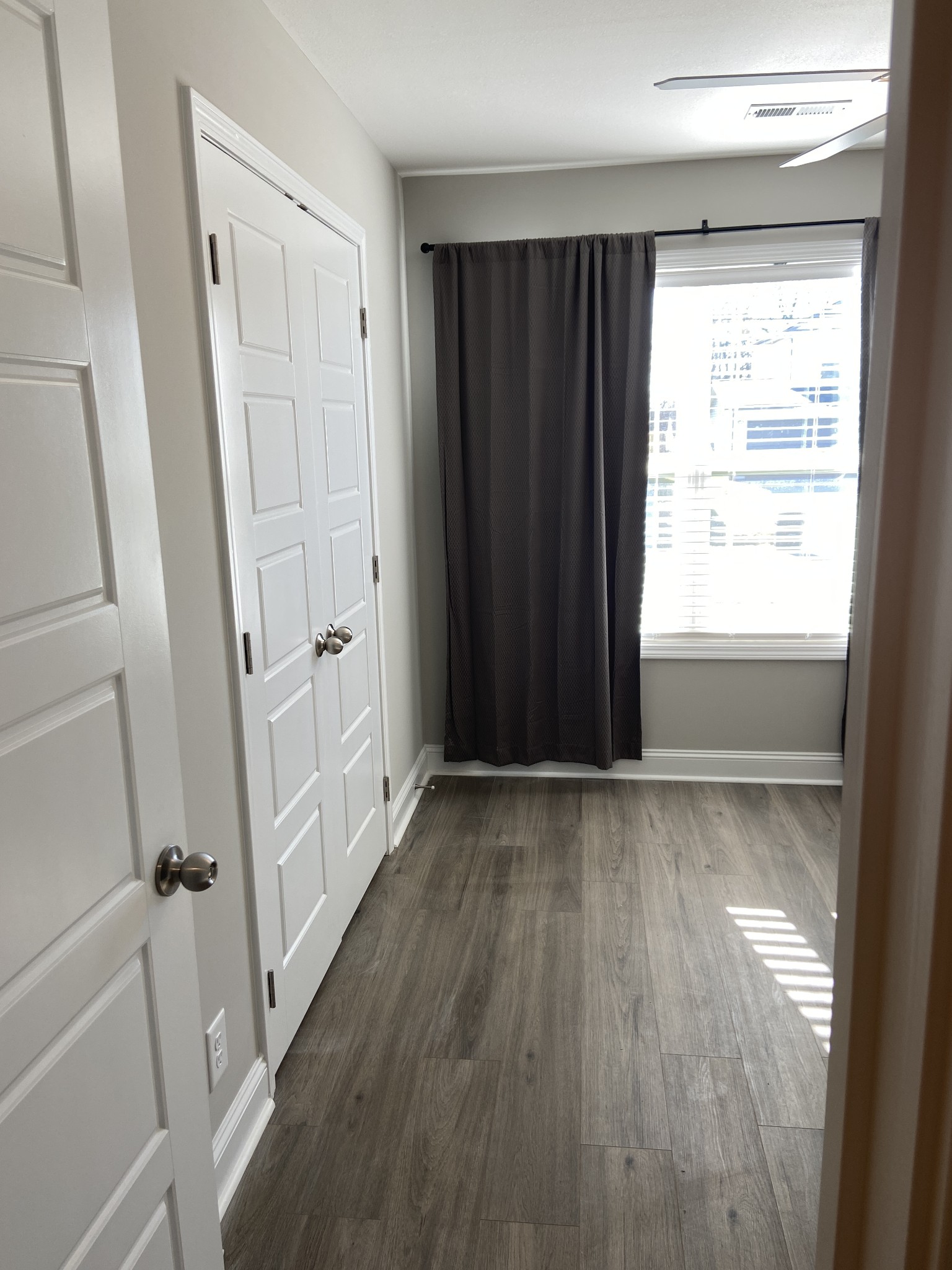 211 King Road Clarksville, TN 37042 - Photo 21 of 35 a view of empty room with wooden floor and fan
