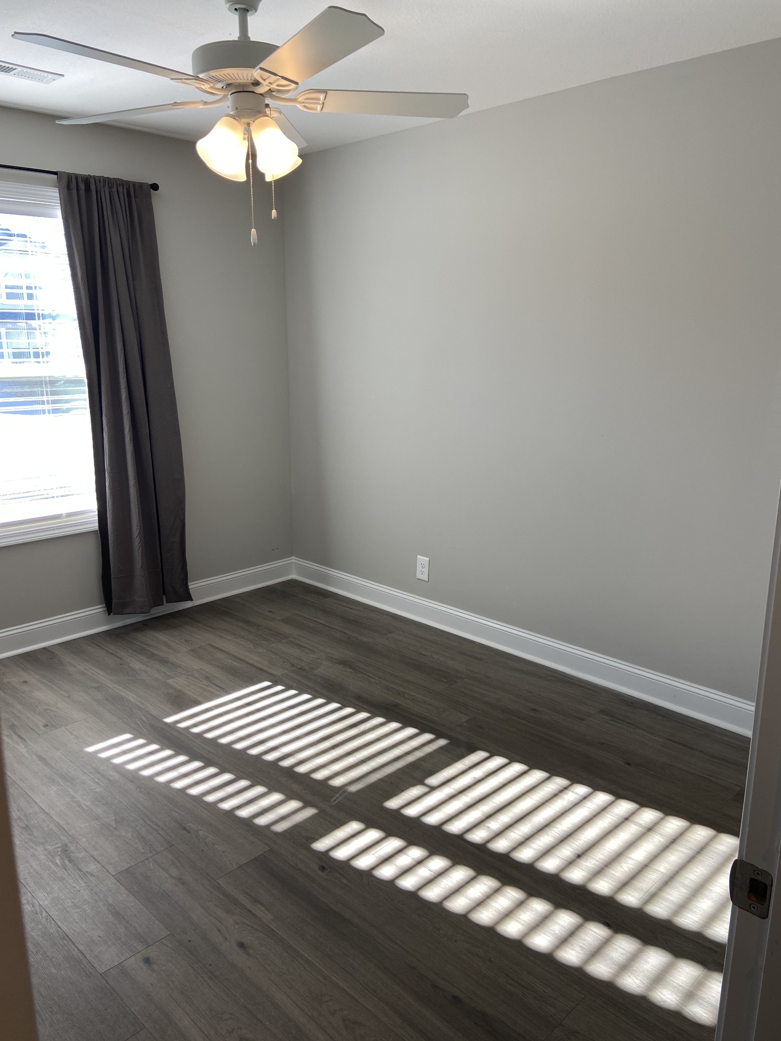 211 King Road Clarksville, TN 37042 - Photo 22 of 35 wooden floor in an empty room with a window