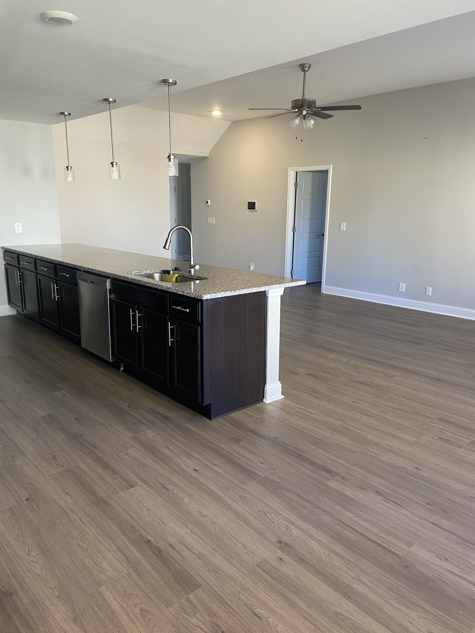 211 King Road Clarksville, TN 37042 - Photo 9 of 35 a room with kitchen island stainless steel appliances wooden floor sink and cabinets