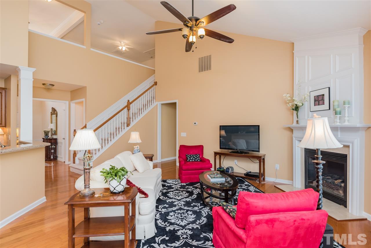 5112 Kate Denson Way Raleigh, NC 27612 - Photo 13 of 25 a living room with furniture and a fireplace