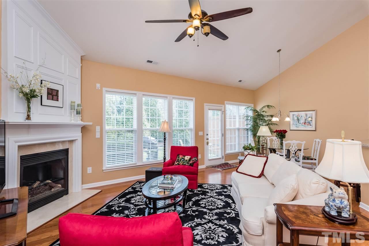 5112 Kate Denson Way Raleigh, NC 27612 - Photo 14 of 25 a living room with furniture or couch and a fireplace