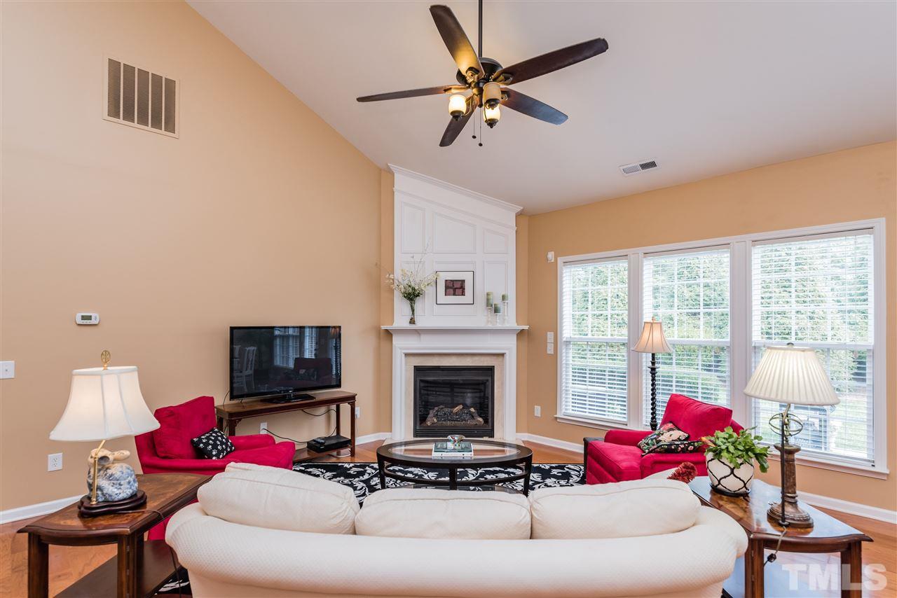 5112 Kate Denson Way Raleigh, NC 27612 - Photo 15 of 25 a living room with furniture and a flat screen tv