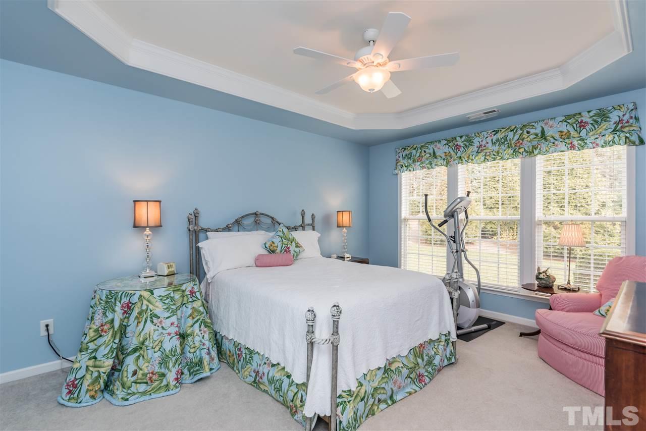 5112 Kate Denson Way Raleigh, NC 27612 - Photo 16 of 25 a bedroom with a bed and a couch