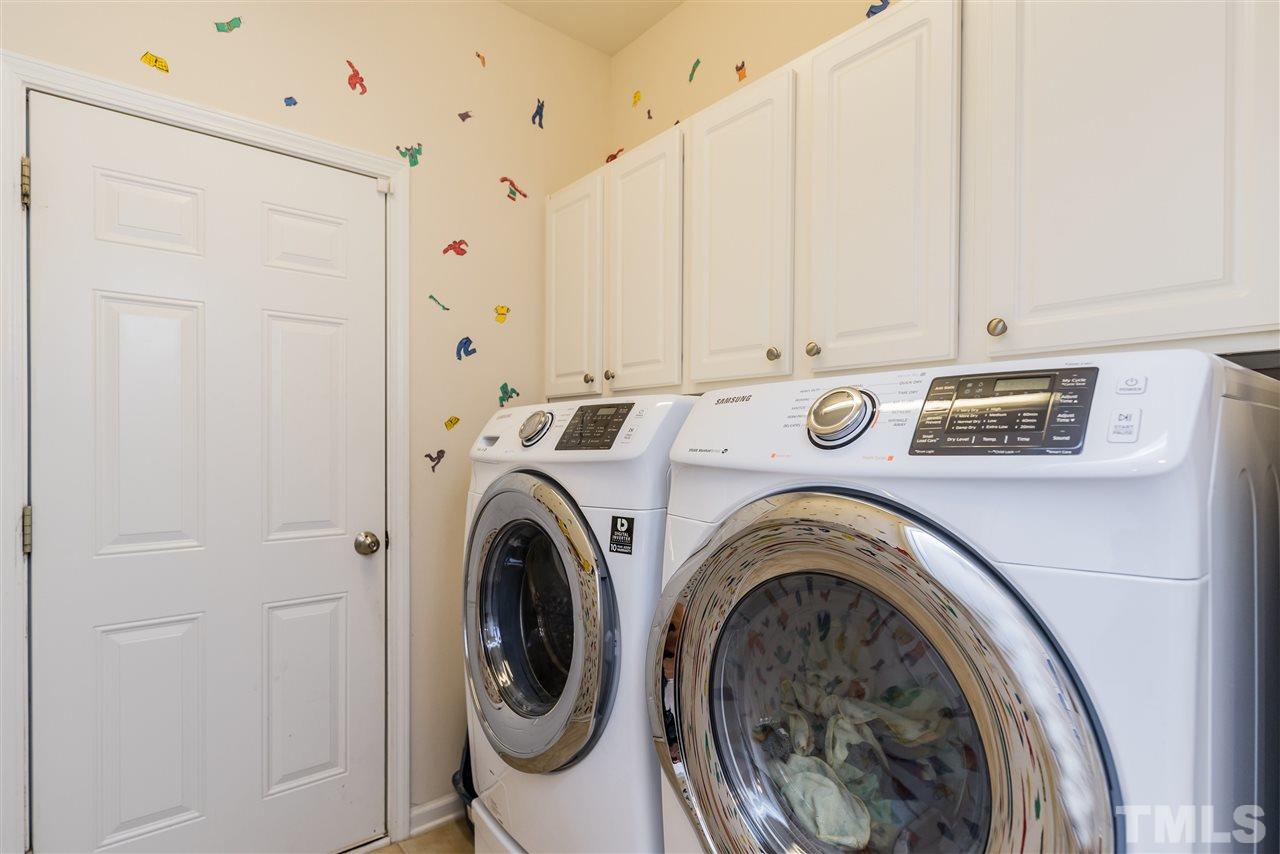 5112 Kate Denson Way Raleigh, NC 27612 - Photo 19 of 25 a view of a storage & utility room with dryer and washer