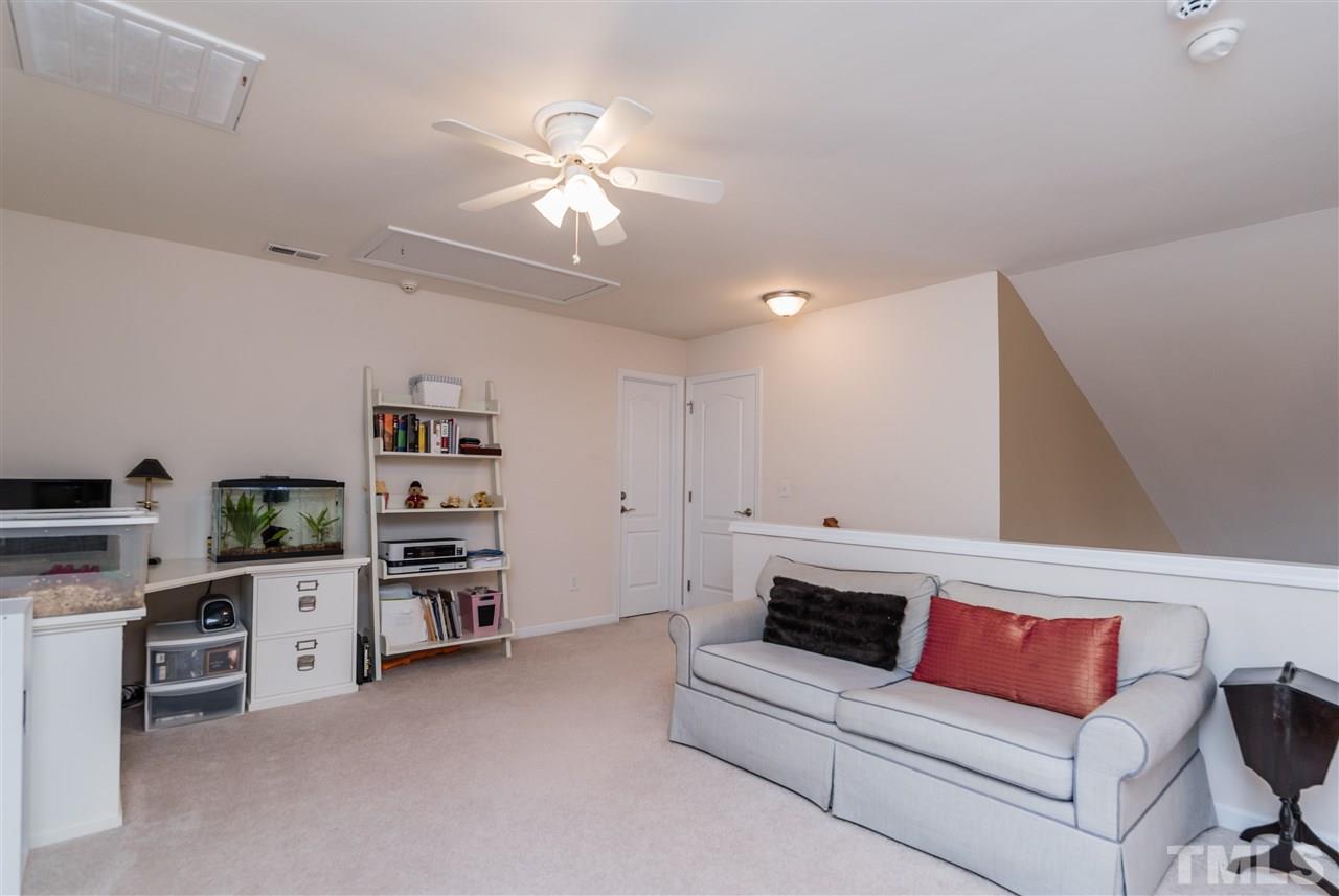 5112 Kate Denson Way Raleigh, NC 27612 - Photo 20 of 25 a living room with furniture and kitchen view