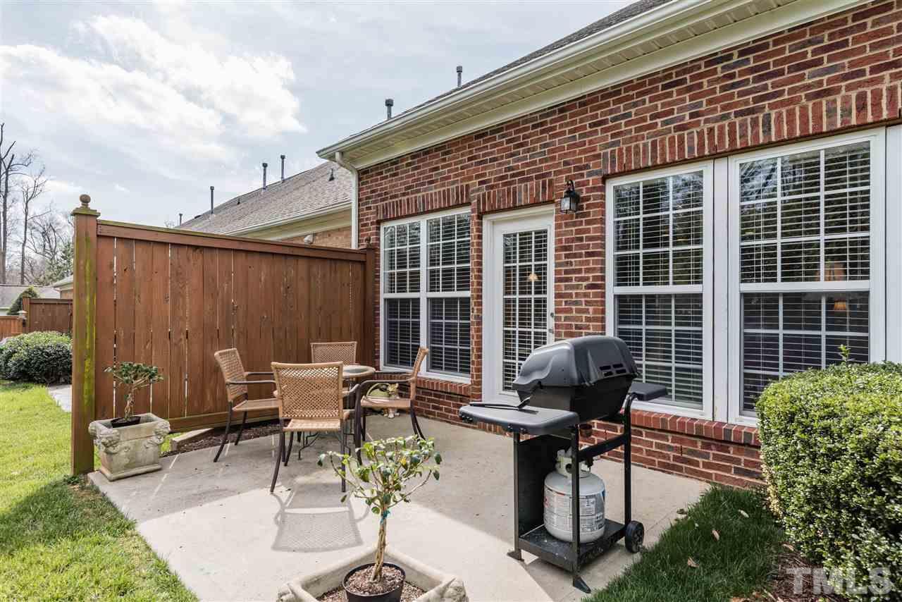 5112 Kate Denson Way Raleigh, NC 27612 - Photo 24 of 25 a view of a patio with a chairs and table in a patio