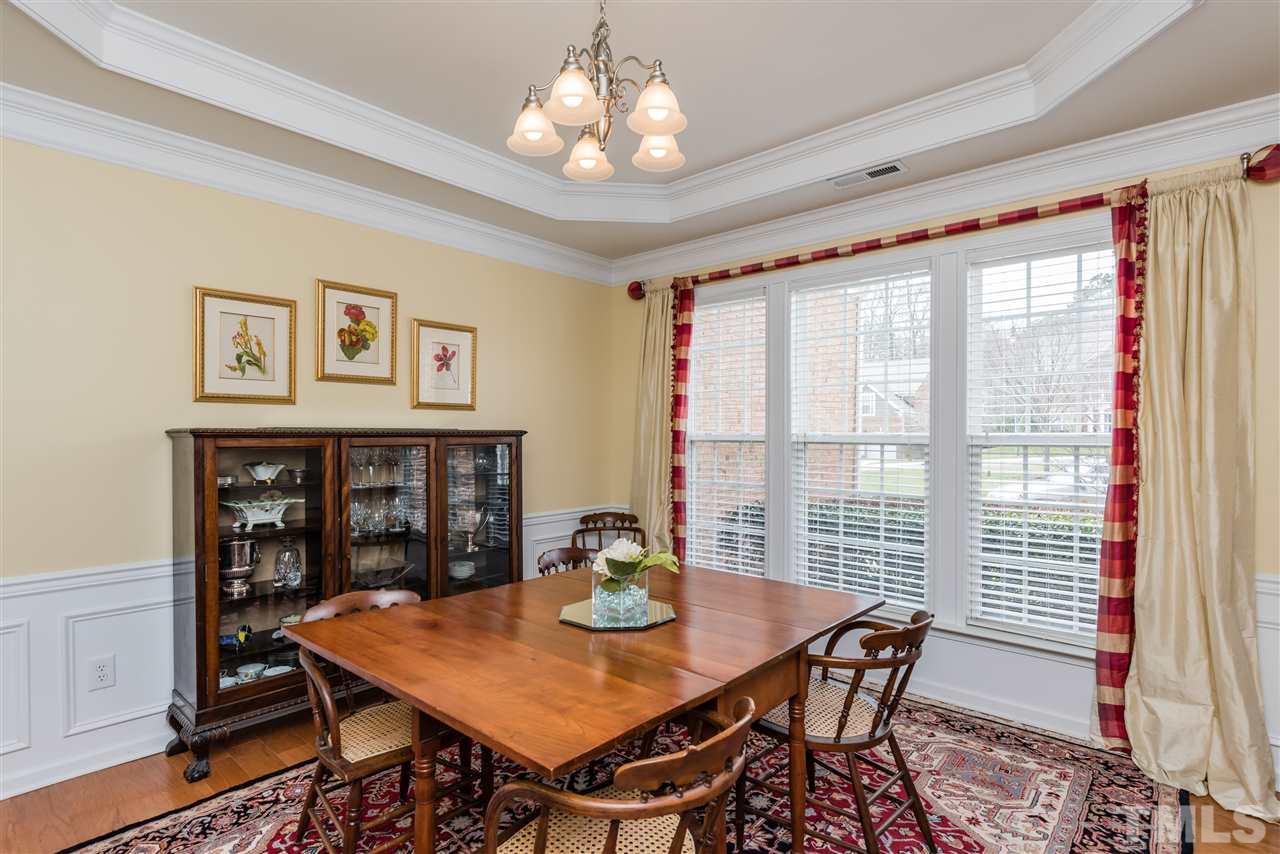 5112 Kate Denson Way Raleigh, NC 27612 - Photo 5 of 25 a view of a dining room with furniture window and wooden floor