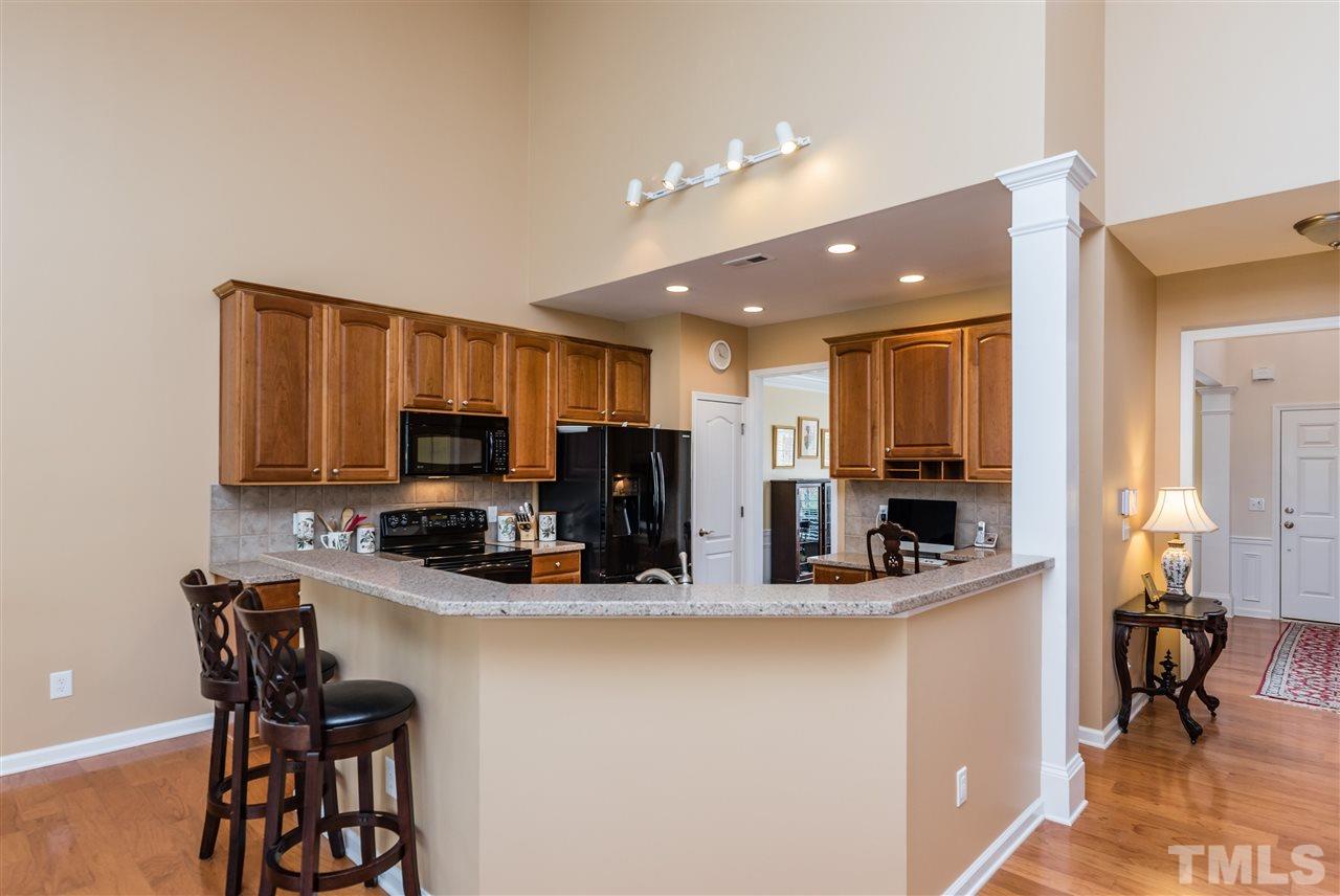 5112 Kate Denson Way Raleigh, NC 27612 - Photo 7 of 25 a kitchen with a refrigerator and a sink