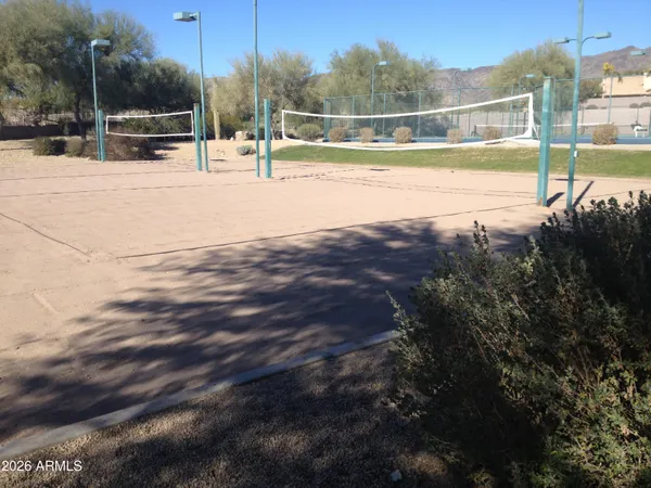 a view of a swimming pool with an outdoor seating