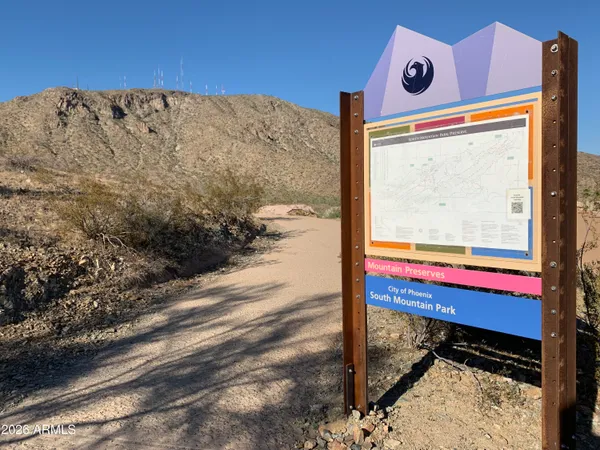 a view of a small pool with wooden fence