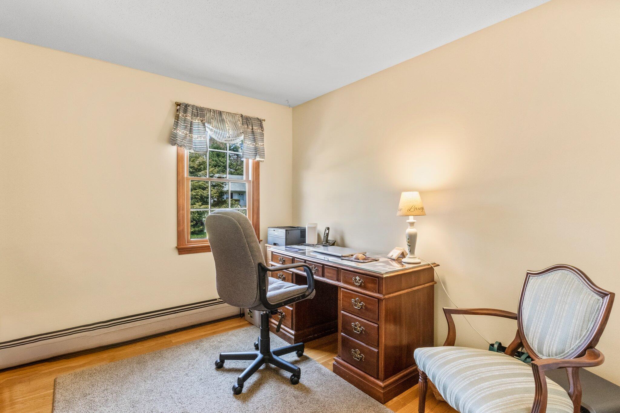 131 Seth Parker Road Centerville, MA 02632 - Photo 14 of 55 a view of a workspace with furniture and a window