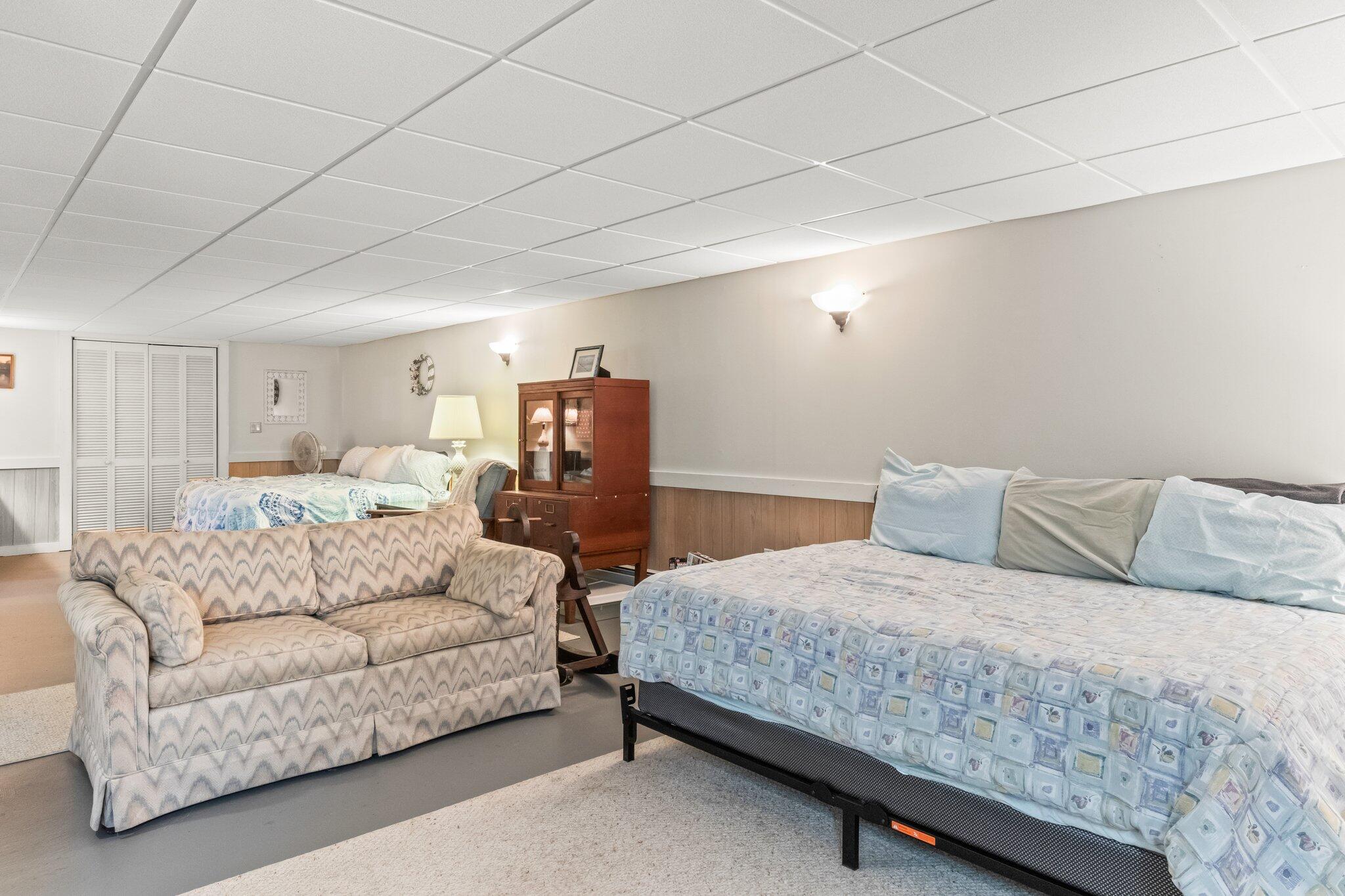 131 Seth Parker Road Centerville, MA 02632 - Photo 17 of 55 a bedroom with a bed and a couch