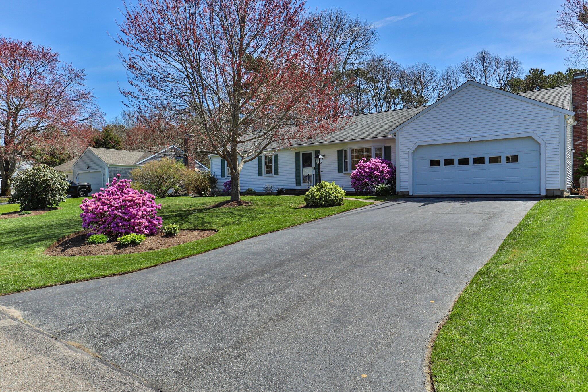 131 Seth Parker Road Centerville, MA 02632 - Photo 2 of 55 a view of a house with a yard and garage
