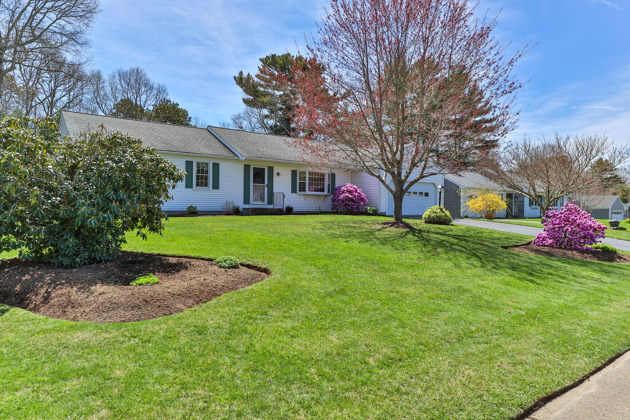 131 Seth Parker Road Centerville, MA 02632 - Photo 22 of 55 a front view of a house with garden