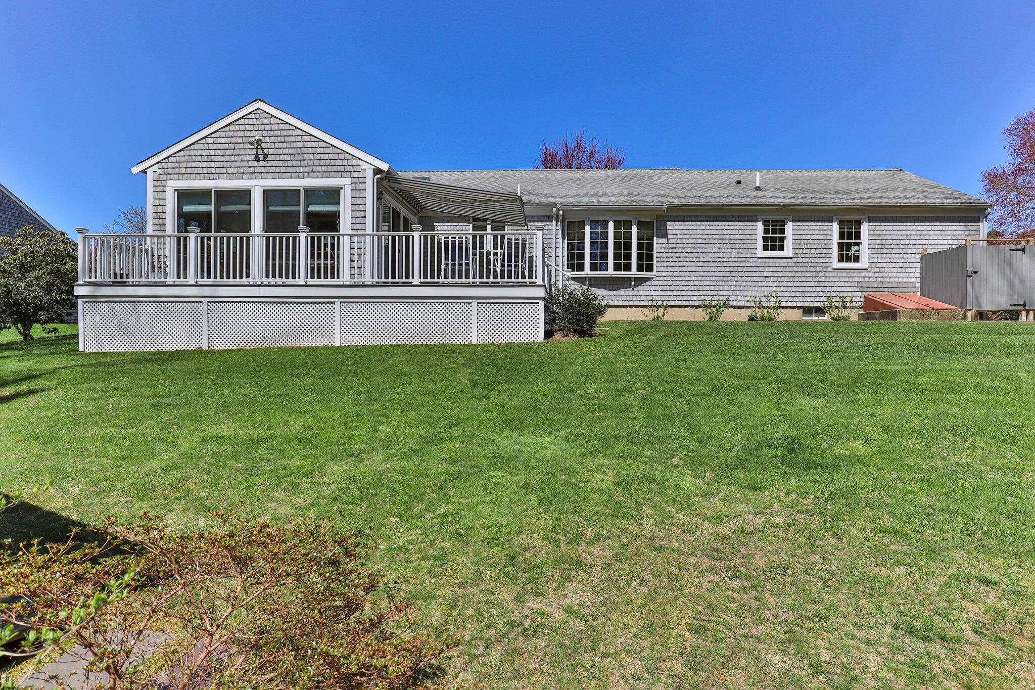 131 Seth Parker Road Centerville, MA 02632 - Photo 3 of 55 a front view of a house with a garden