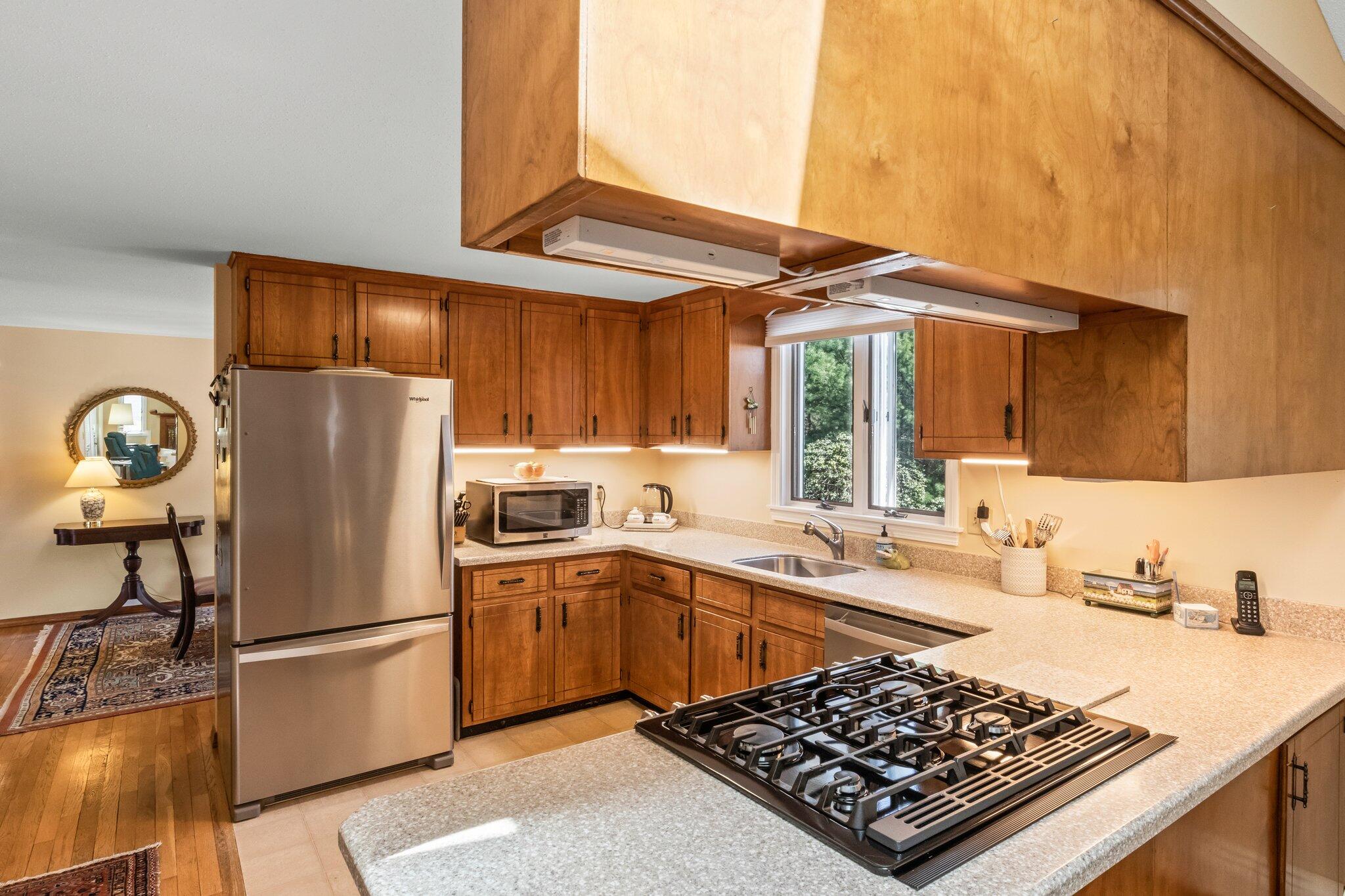 131 Seth Parker Road Centerville, MA 02632 - Photo 31 of 55 a kitchen with stainless steel appliances granite countertop a sink stove and refrigerator