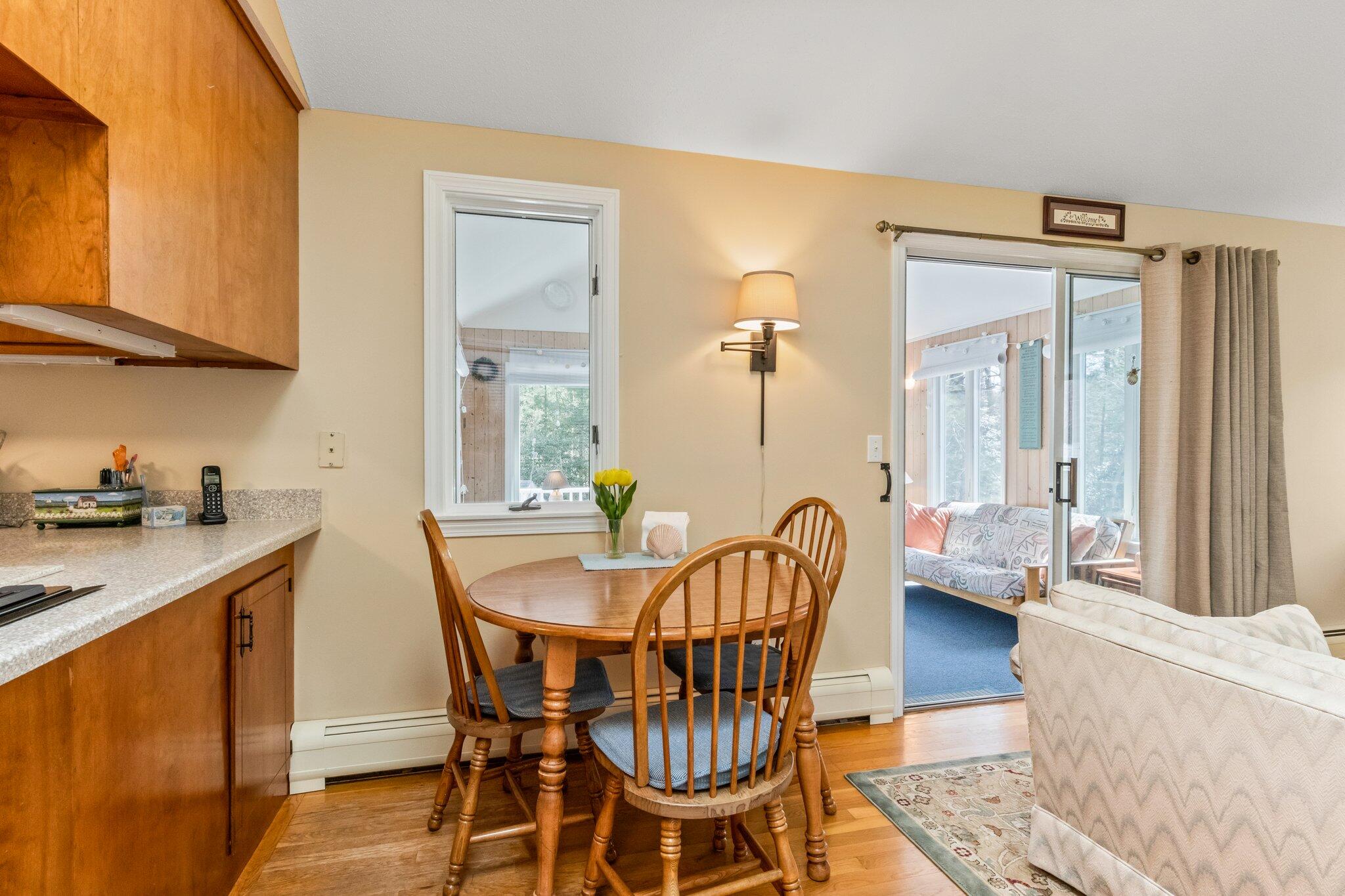 131 Seth Parker Road Centerville, MA 02632 - Photo 33 of 55 a dining room with furniture and wooden floor