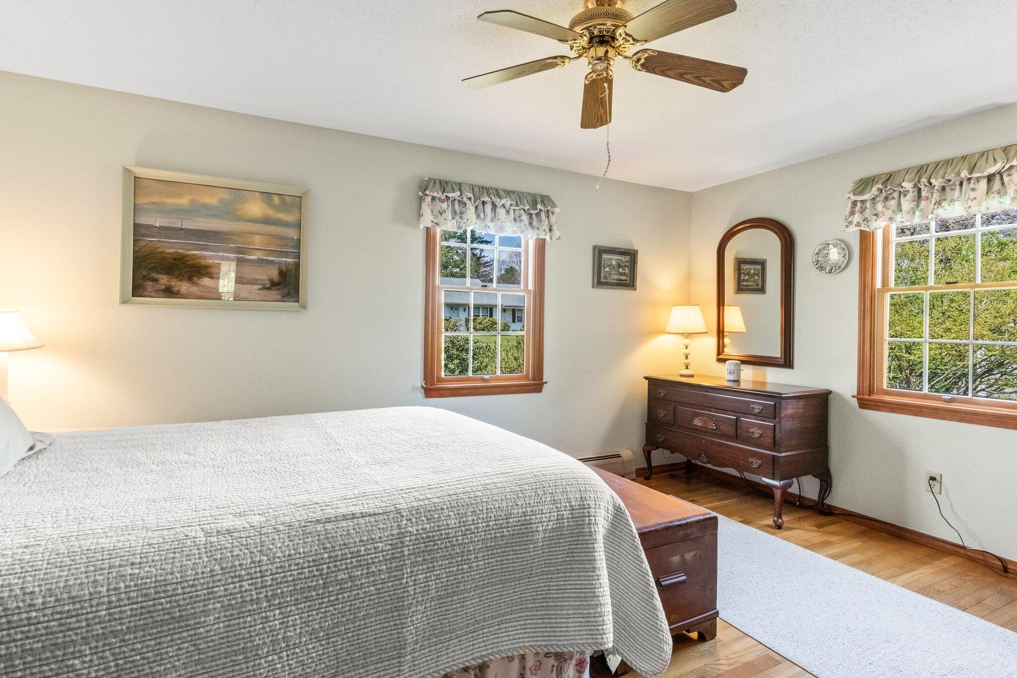 131 Seth Parker Road Centerville, MA 02632 - Photo 37 of 55 a bedroom with a bed and a dresser