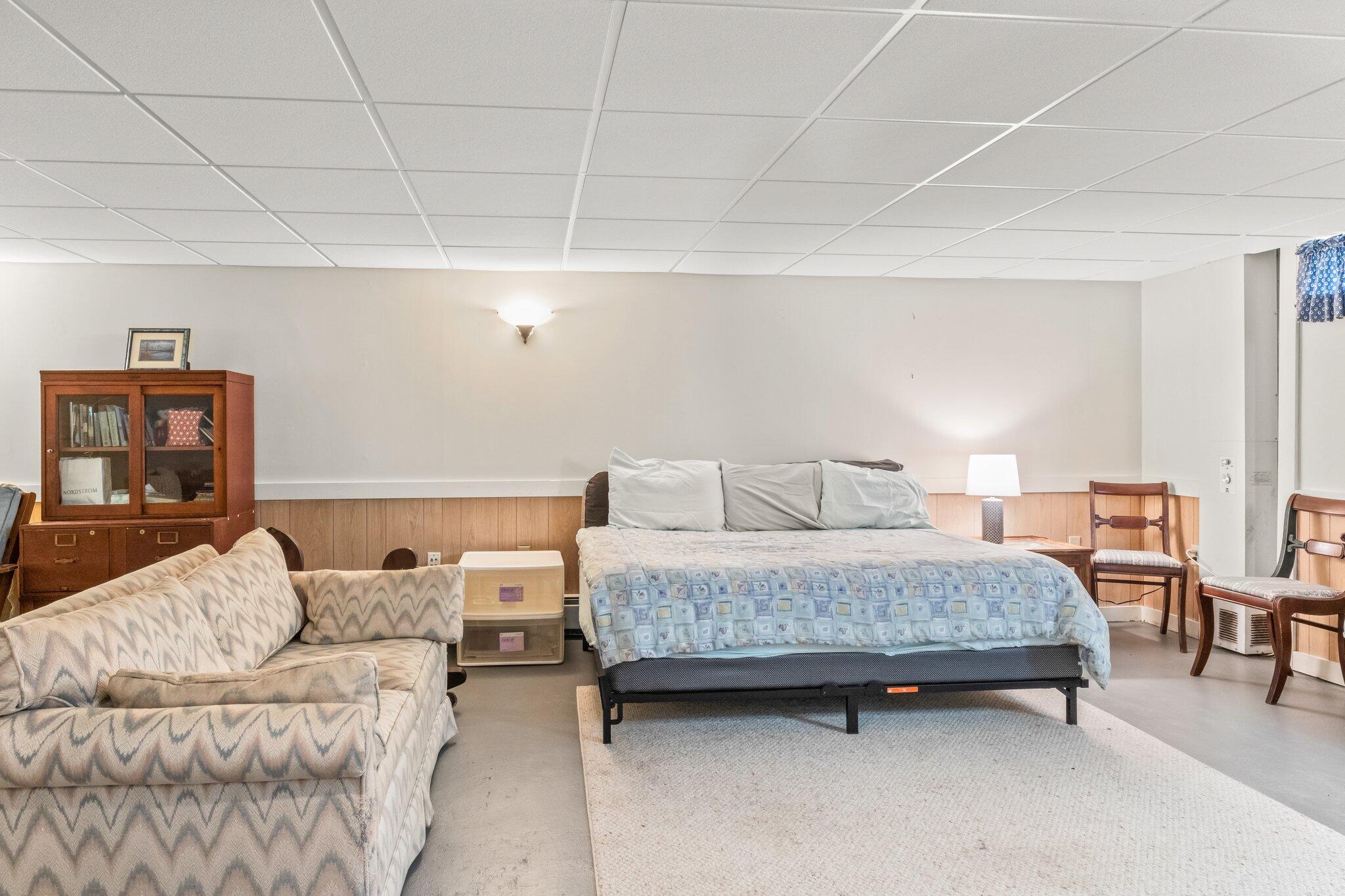 131 Seth Parker Road Centerville, MA 02632 - Photo 42 of 55 a spacious bedroom with a bed and a couch