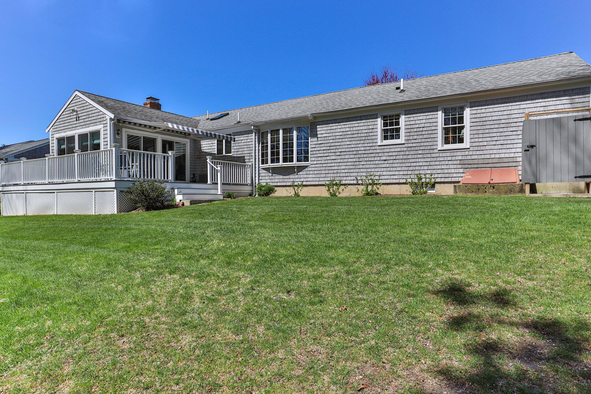 131 Seth Parker Road Centerville, MA 02632 - Photo 47 of 55 a front view of a house with a garden