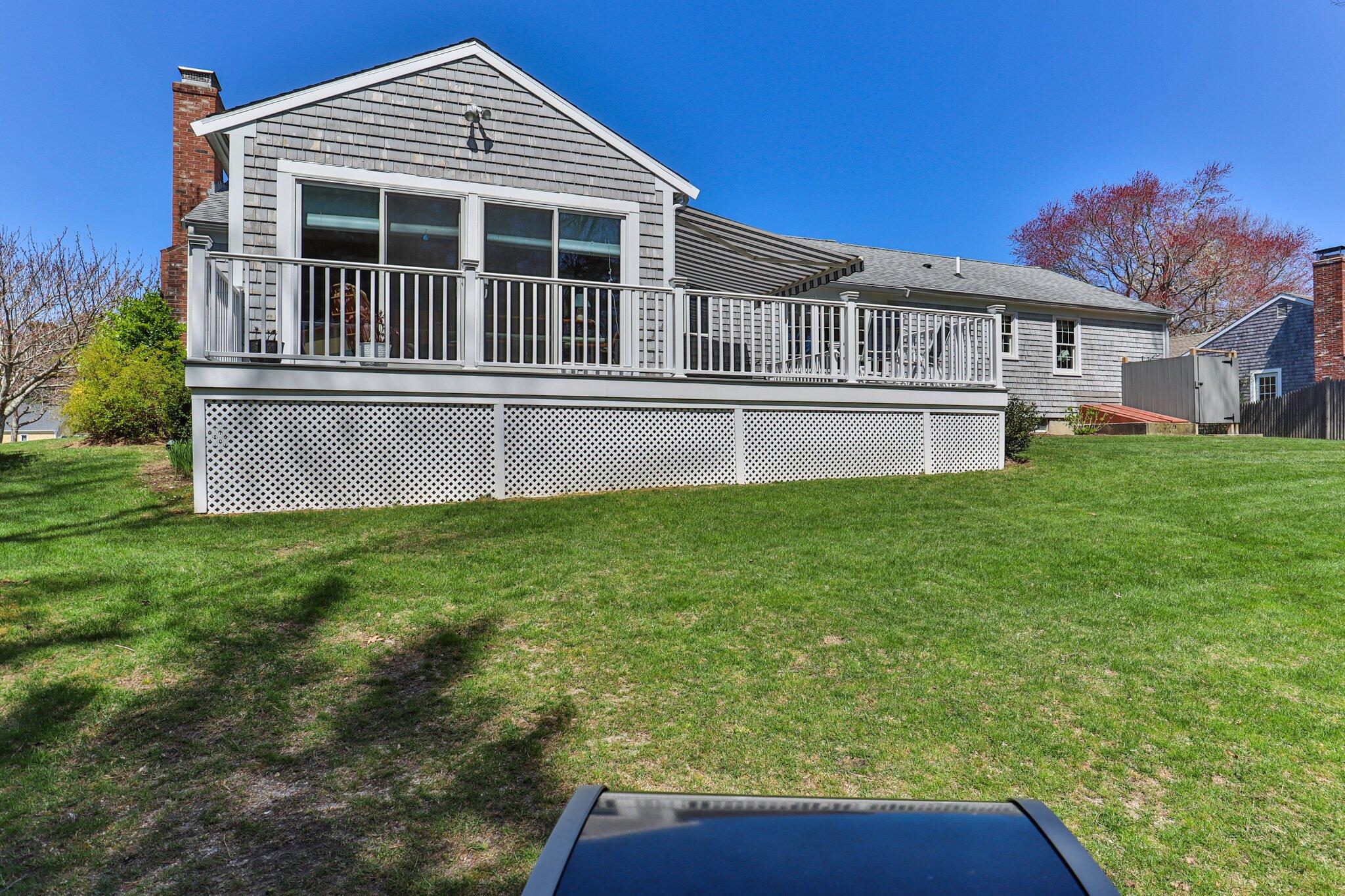 131 Seth Parker Road Centerville, MA 02632 - Photo 49 of 55 a front view of a house with a garden