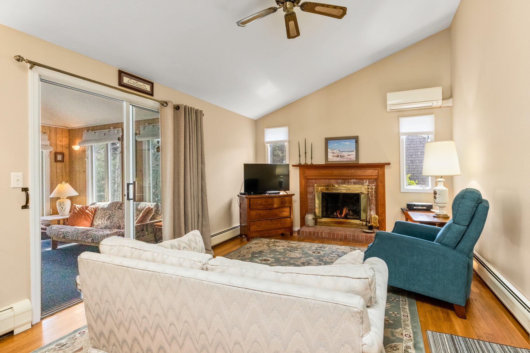 131 Seth Parker Road Centerville, MA 02632 - Photo 8 of 55 a living room with furniture and a fireplace