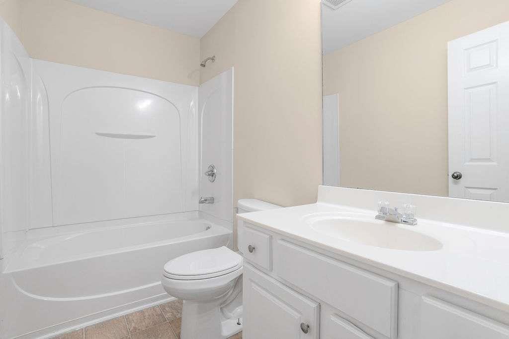 2757 Keystone Avenue Lithonia, GA 30058 - Photo 20 of 28 a bathroom with a sink toilet and bathtub