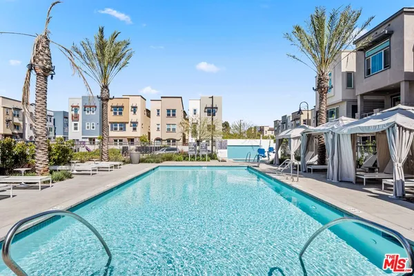 a view of a swimming pool with a lounge chairs