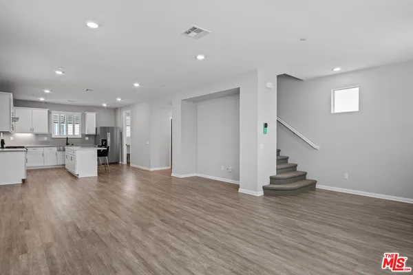 a view of kitchen with wooden floor and a kitchen