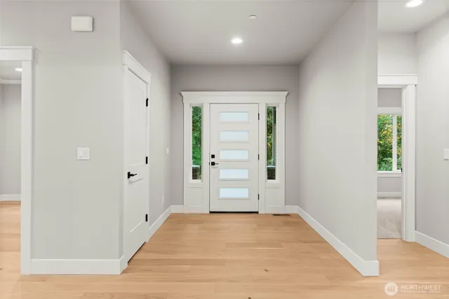wooden floor in an empty room with wooden door