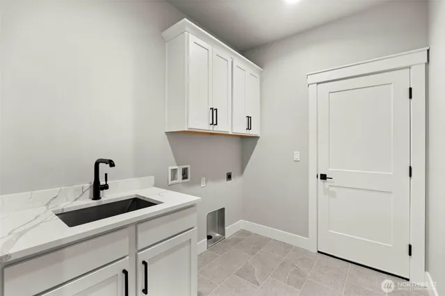 a kitchen with a sink and cabinets