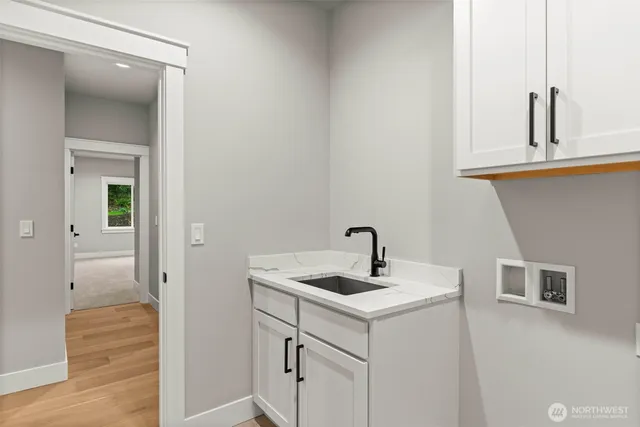 a bathroom with a sink and mirror