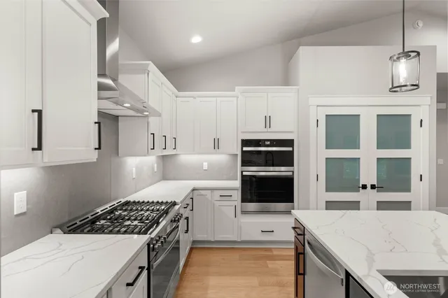 a kitchen with a stove and a refrigerator