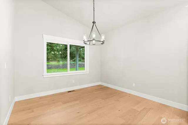 a room with a window and a ceiling fan