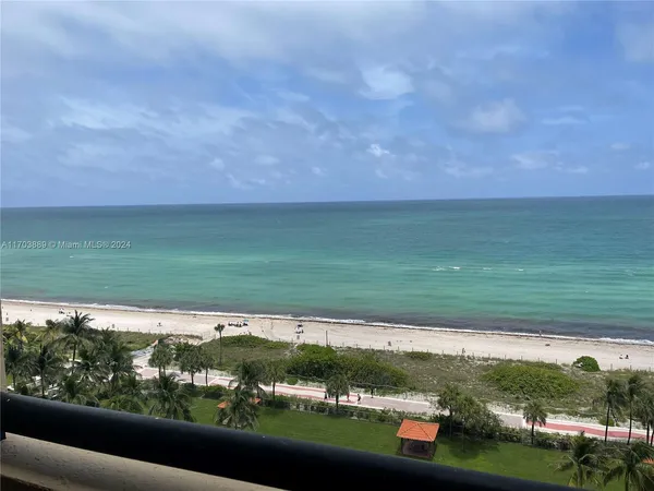 a view of a yard with a table and a chair