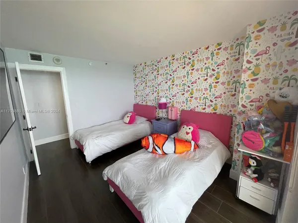 a bedroom with a bed and a couch