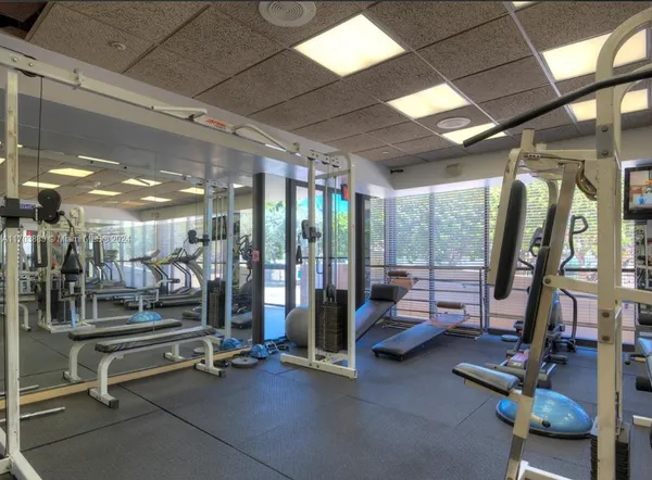 a kitchen with stainless steel appliances granite countertop a sink and a refrigerator