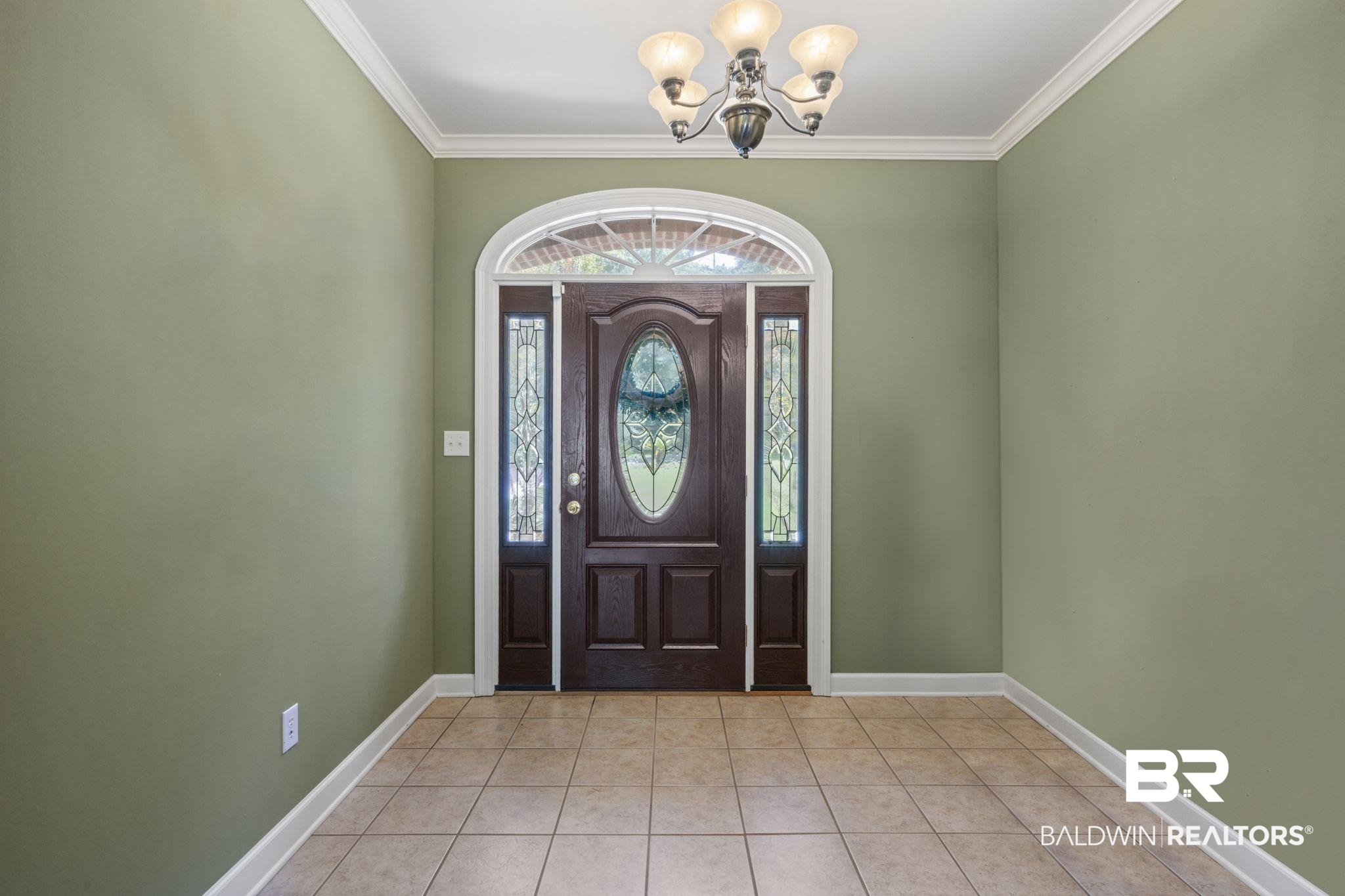 5618 Leytham Road Theodore, AL 36582 - Photo 10 of 60 Tiled foyer featuring ornamental molding, plenty of natural light, and a chandelier