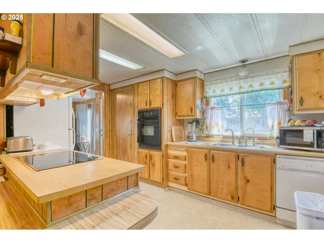 a spacious bathroom with a granite countertop sink and a large mirror