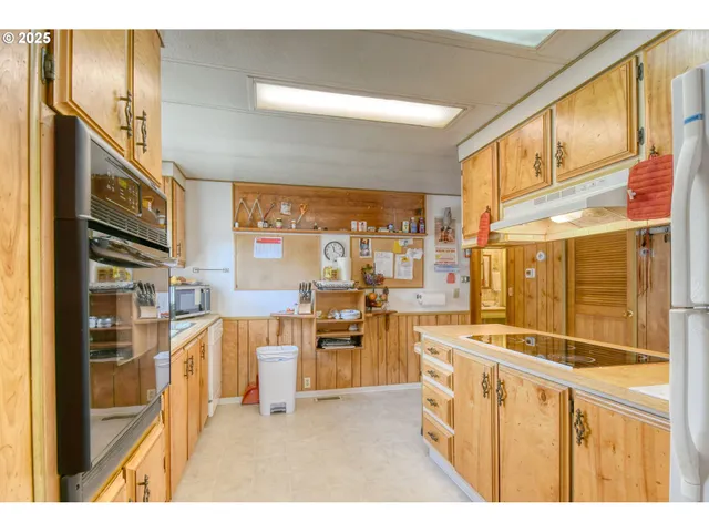 a view of a kitchen with furniture a kitchen view and a window