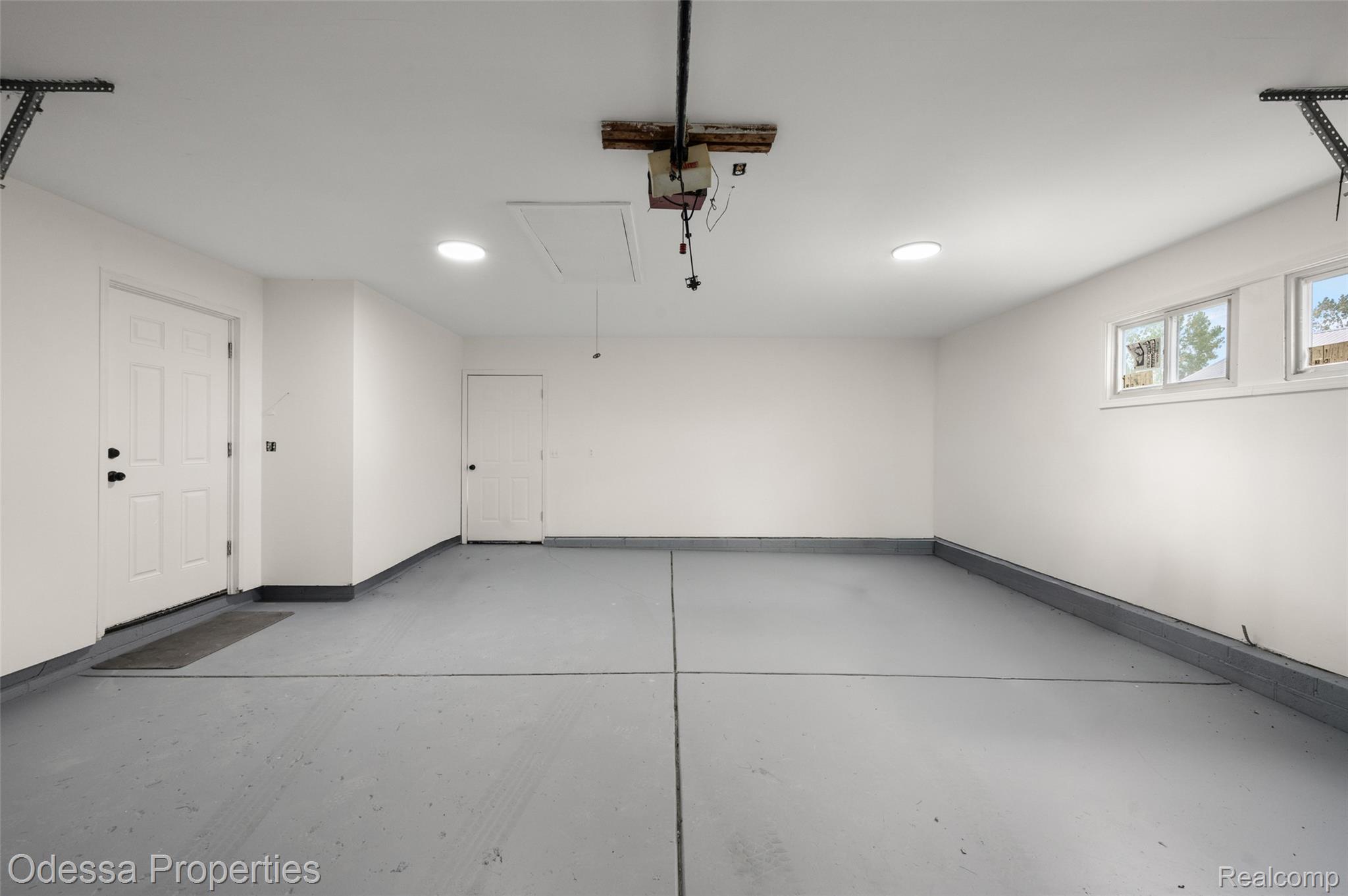 1442 Riley Center Road Memphis, MI 48041 - Photo 44 of 62 Garage featuring recessed lighting and a garage door opener