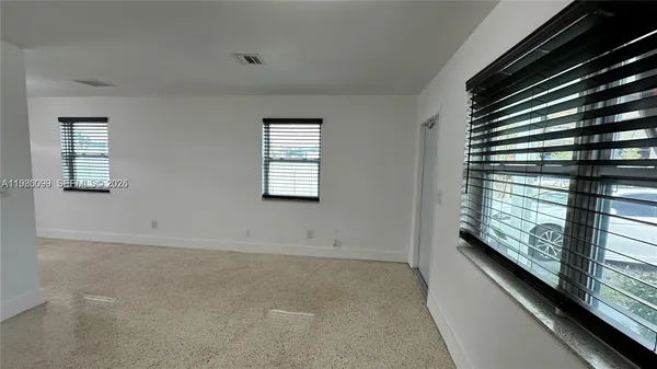 a view of an empty room and window