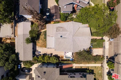 a aerial view of a house with a yard and garden